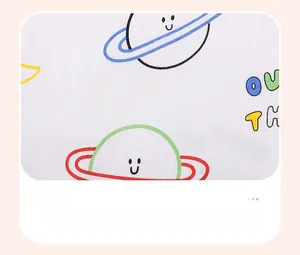 Detail of soft cotton knit fabric with colorful cartoon space and planet water-ink prints