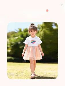 Detail of girls' rainbow heart sequin dress with multi-layer mesh tulle skirt