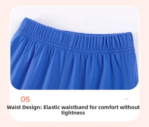 Close-up of the elastic waistband and fine stitching on kids' navy cotton shorts