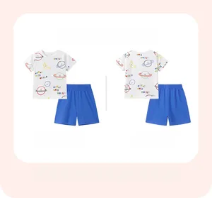 Detail of cotton kids summer set featuring a planet print T-shirt and navy shorts