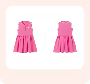 Detail of pink cotton sleeveless polo dress featuring heart embroidery and buttoned collar