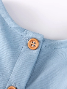 Blue denim sleeveless girls dress with natural wooden button and cherry embroidery detail