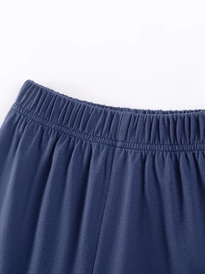 Close-up of dark blue boys cotton shorts with elastic waistband and high-quality stitching