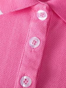 Pink cotton pique polo dress for girls featuring a classic collar and white buttons