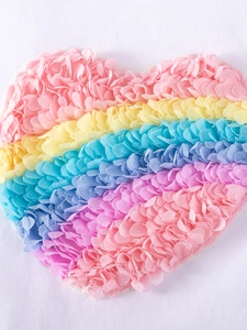 White cotton girls dress featuring a colorful 3D rainbow mesh heart applique detail