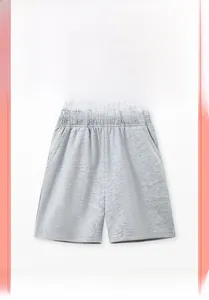 Detail of light gray cotton boys' casual shorts featuring elastic waistband and pockets