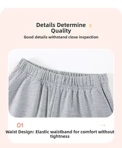 Close-up of boys' grey cotton shorts showing the elastic waistband and fine knit texture