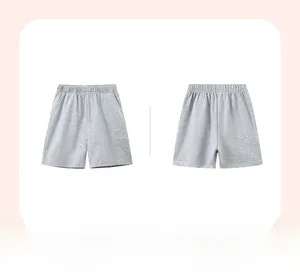 Detailed front and back view of light gray cotton shorts with elastic waistband and pockets