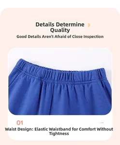 Detail of boys' navy cotton shorts featuring a wide elastic waistband and reinforced stitching