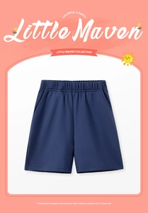 Detail view of cotton shorts for boys featuring an elastic waistband and side pockets