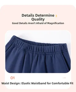 Detail of navy blue cotton shorts featuring a comfortable elastic waistband for boys