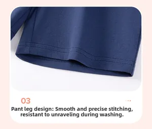 Detail of navy blue cotton shorts showing reinforced double-stitch hem and fine fabric