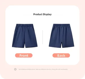 Front and back detail of boys dark blue cotton shorts with elastic waistband and pockets
