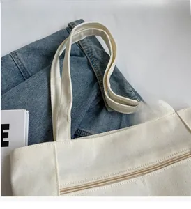Detail of canvas tote bag with zipper closure and reinforced stitching for daily use