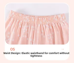 Dettaglio vita elastica su pantaloncini rosa a fiori per bambina con cuciture rifinite