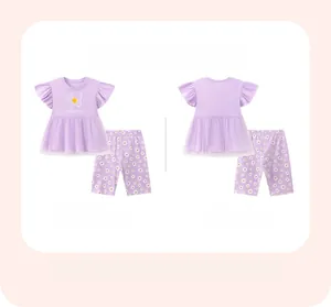 Flat lay of girl's summer set with daisy pattern, featuring front and back views in lavender