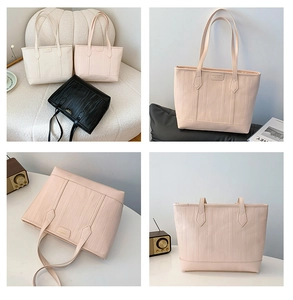 Detail shot of large capacity tote bags in beige, pink, and black with wave texture