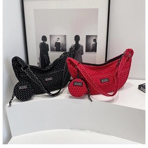 Detail of half-moon crossbody bags with matching round coin purses and Sport logo