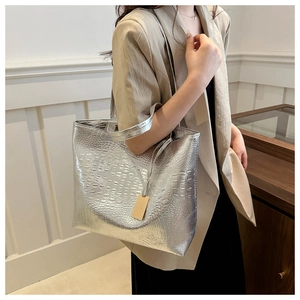 Silver crocodile pattern tote bag shown over the shoulder for stylish daily commuting