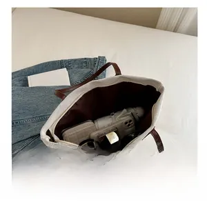 Top view of large canvas tote bag showing spacious interior with daily essentials