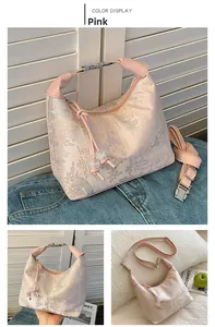 Detail of pink jacquard handbag featuring vintage nature patterns and a metal clasp