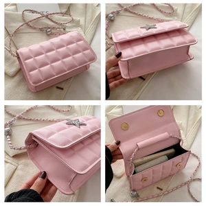 Detailed views of pink quilted crossbody bag with star ornament and gold chain strap