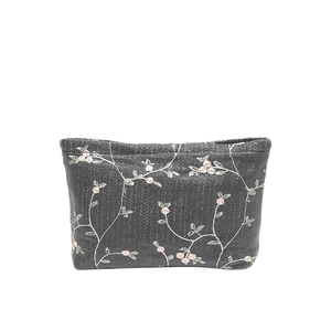 Deep grey embroidered lace makeup bag with pink flower pattern and woven texture