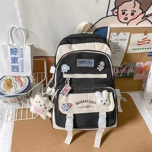 Black white contrast canvas backpack school bag with cute plush charms and large daily capacity