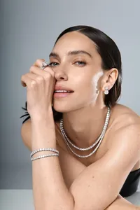 Close-up of model wearing S925 sterling silver moissanite tennis necklace and bracelet set