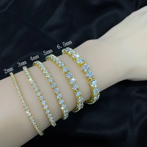 Detailed size comparison of 2mm to 6.5mm gold moissanite tennis bracelets on wrist