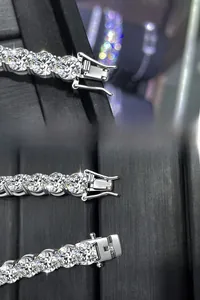 Detail view of the spring clasp on a sterling silver moissanite tennis bracelet