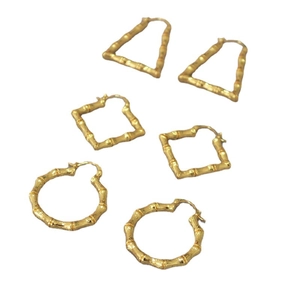 Golden brass earrings set with geometric shapes and vintage bamboo texture for women