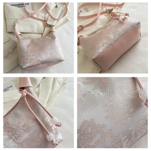 Detail of pink embroidered silk handbag featuring traditional Chinese landscape patterns