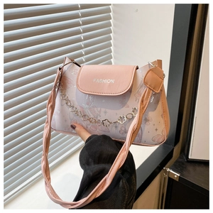 Detail of pink floral shoulder bag with butterfly patterns and decorative flower chain