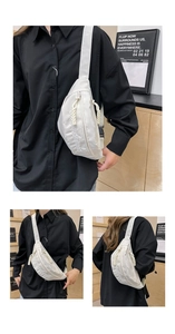 Détails du sac banane blanc minimaliste montrant les fermetures éclair à nœuds et sangle