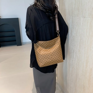 Brown vintage hobo tote bag with geometric print and striped wide shoulder strap