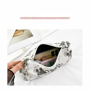Detailed interior view of a floral Boston bag showing large storage capacity for essentials