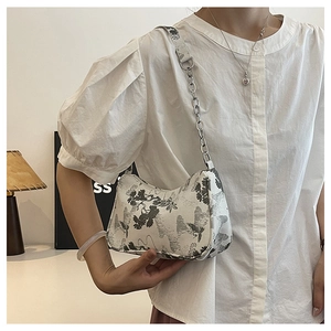 Detail of white butterfly shoulder bag with crane ink painting and silver chain handle