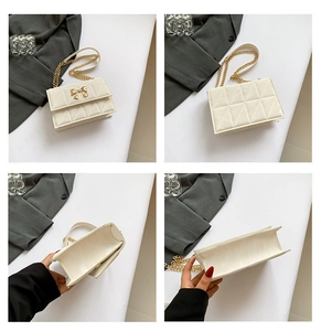 Detailansicht der weißen Stepptasche mit goldenem Schmetterlingsverschluss und Kette