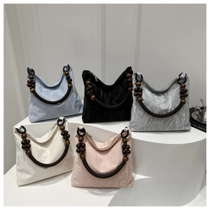 Chic tote bags in five colors with unique beaded wood handles and marbled texture
