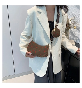 Detail of corduroy crossbody bag with cherry pattern and detachable mini round coin purse