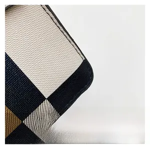 Macro shot of durable cross-grain textured fabric on a striped crossbody bag