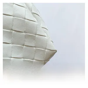 Detail shot of the premium white leather wide-weave texture on this tote handbag