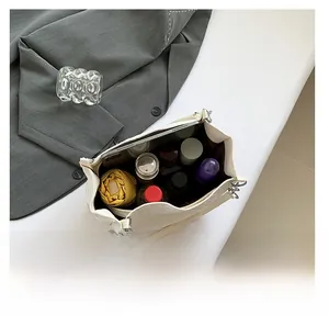 Top view of large capacity white woven tote bag showing storage for iPad and umbrella