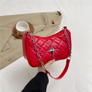 Red quilted crescent underarm bag with silver star hardware and chain strap