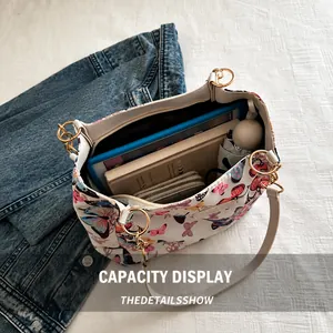 Top view of a butterfly print tote bag showing spacious interior for tablets and books