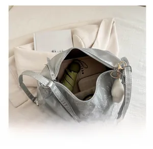 Silver pleated tote bag interior showing large capacity for umbrella and wallet