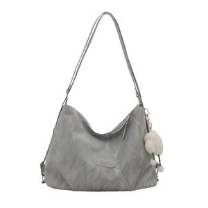 Gray textured shoulder tote bag with soft pleats and a white plush cloud charm accessory