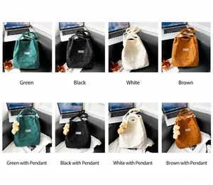 Multiple colors of corduroy tote bags with bear pendants for daily commute and work