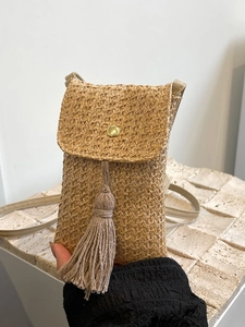 Straw woven crossbody phone bag with fringe tassel and gold button in khaki color